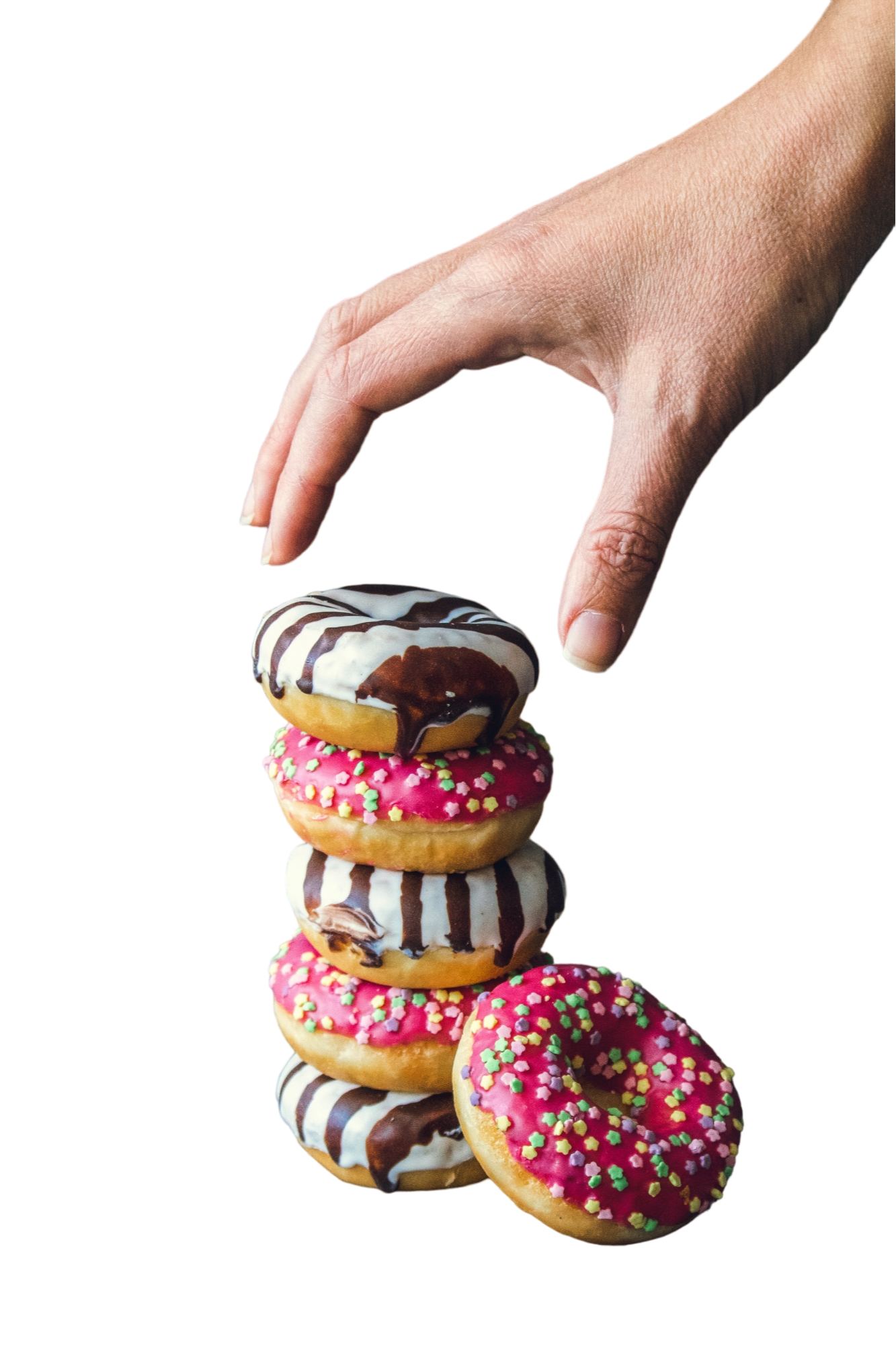 A hand grabbing a stack of donuts